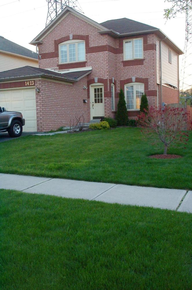 photo of 2 storey home with red brick
